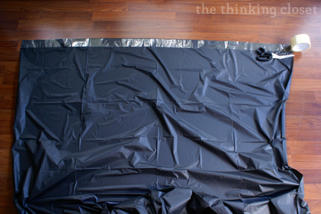 Step 2: Run a strip of clear packing tape across the top of your tablecloth.  