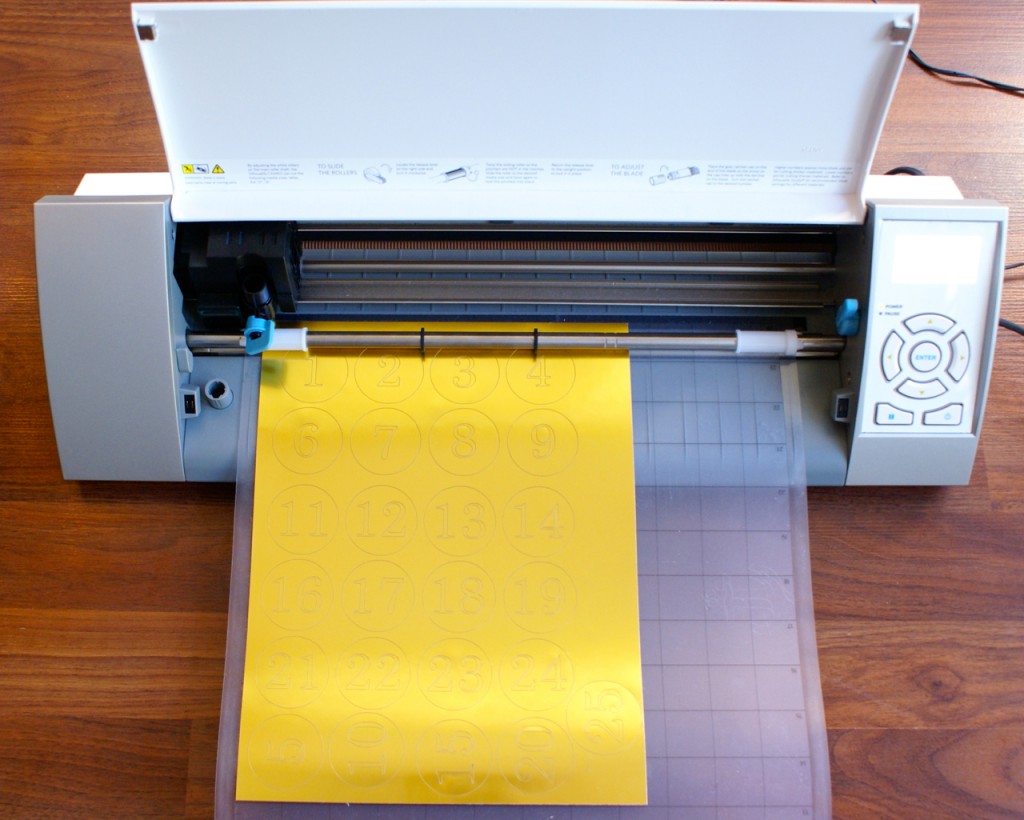Cutting up my printable gold foil to create number stickers. Cutting up my printable gold foil to create number stickers.
