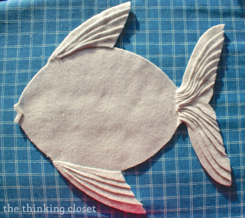 LayeringFelt Layering felt strips to create a textured felt fish pillow! via thinkingcloset.com