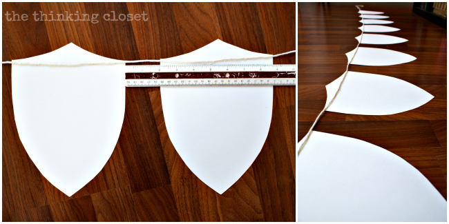 Applying white cotton twine to the backs of the shields. The banner is almost complete! Applying white cotton twine to the backs of the shields. The banner is almost complete!