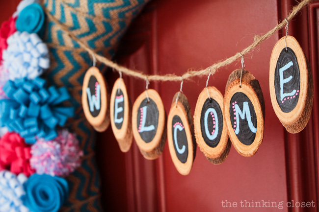 The cutest mini woods slices you ever did see! They make a fantastic "Welcome" banner on this spring felt flower wreath! via thinkingcloset.com The cutest mini woods slices you ever did see! They make a fantastic "Welcome" banner on this spring felt flower wreath! via thinkingcloset.com