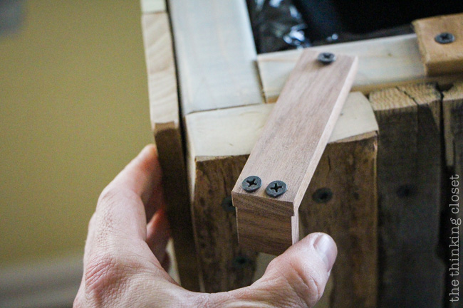 Creating the side door latch for the Rustic Pallet Recycle Bin.  Tutorial via thinkingcloset.com