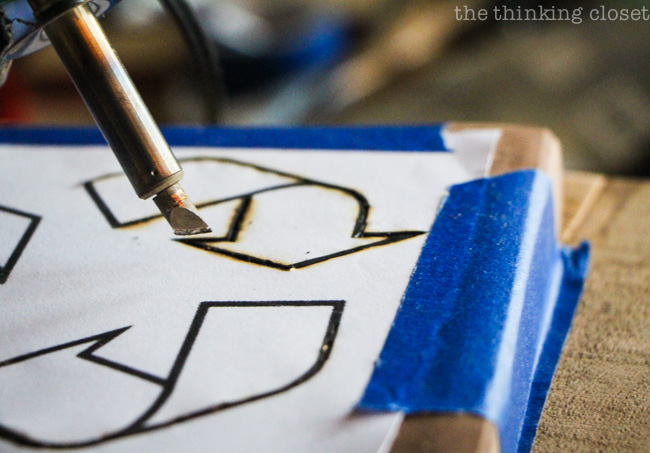 Woodburning the recycle logo into the "trap door" of the Rustic Pallet Recycle Bin via thinkingcloset.com Woodburning the recycle logo into the "trap door" of the Rustic Pallet Recycle Bin via thinkingcloset.com