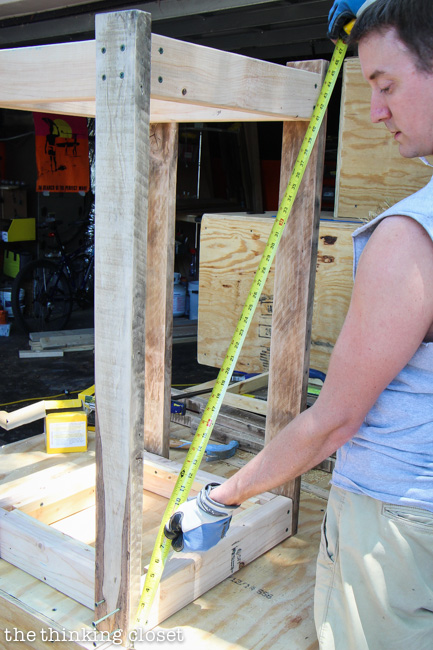 Checking that the frame is square! A very important step in the process of building a Rustic Pallet Recycle Bin. Checking that the frame is square! A very important step in the process of building a Rustic Pallet Recycle Bin.