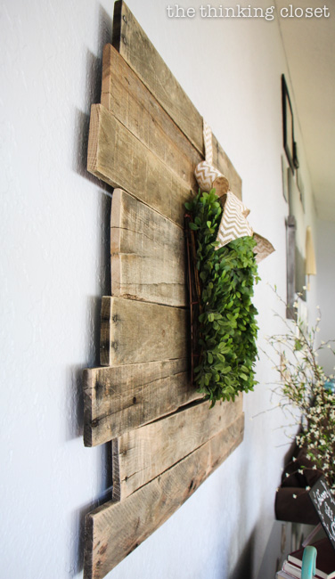Rustic Vintage Spring Mantel: a pallet sign is the lovely backdrop for a boxwood wreath! via thinkingcloset.com Rustic Vintage Spring Mantel: a pallet sign is the lovely backdrop for a boxwood wreath! via thinkingcloset.com