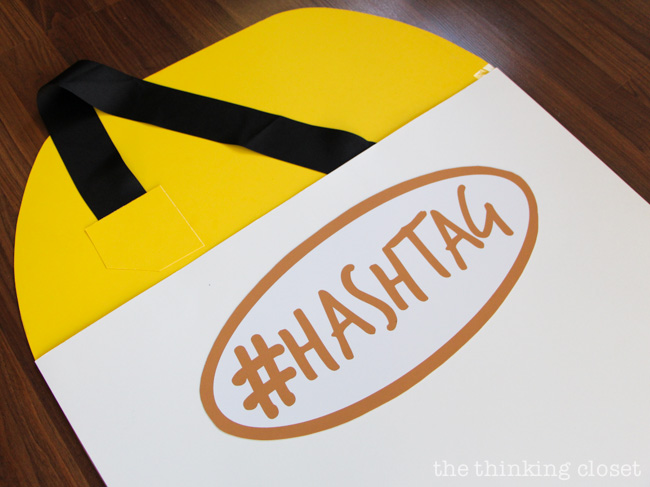 Black ribbon strap to help hold up our Punny #Hashtag Halloween Costume for Couples. Full tutorial & FREE Silhouette cut file via thinkingcloset.com
