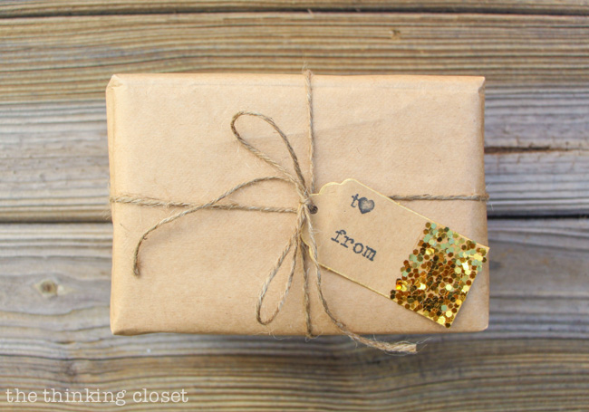 Glitter-Dipped Gift Tags | A simple way to add some rustic glam goodness to your brown paper packages this holiday season. I just love how easy this tutorial is! 