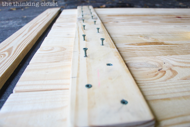 DIY Coastal Wood Plank Photo Backdrop  |  Drilling through the connector pieces.