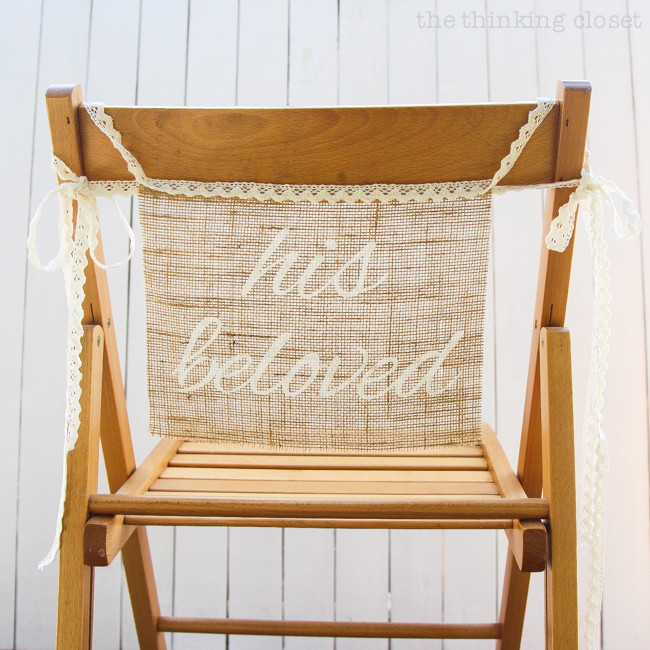 DIY Burlap Chair Signs for the Bride & Groom | Step by step freezer paper stenciling tutorial including FREE Silhouette cut file! These "his beloved" and "her beloved" chair banners are the perfect addition to a rustic wedding!