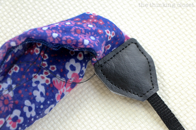 Stitching the leather pieces together.  Just another step in the DIY Scarf Camera Strap Tutorial: Upcycle a scarf into a snazzy camera strap that will quickly become your new favorite accessory. This sewing tutorial will walk you through each step of the fun refashion. Happy Scarf Week 2015!