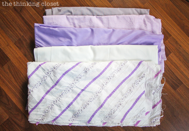 D.I.Y. Shabby Chic Fabric Photo Booth Backdrop | Variety of fabrics in our muted purple color palette, all ready to be shredded into strips! D.I.Y. Shabby Chic Fabric Photo Booth Backdrop | Variety of fabrics in our muted purple color palette, all ready to be shredded into strips!