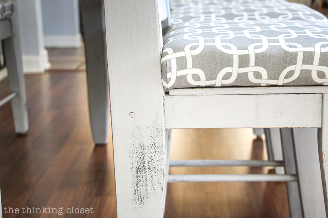 How to Reupholster a Dining Chair Seat: DIY Tutorial full of tips and tricks. Gotta love this "no-mess method" that eliminates the most grueling steps of any reupholstery project! Keep the original seat intact and simply add a new cushion and fabric atop it! This is my kinda' project!