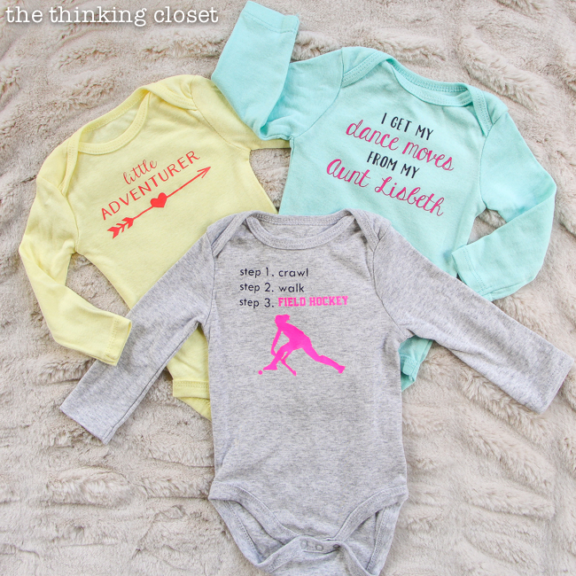3 Creative Onesies for Baby Girl & FREE Silhouette Cut Files | There's really no better baby shower gift than a custom, personalized onesie! So, brace yourself for 3 adorable new onesie designs, each of which can be adapted to suit the parents and the baby (girl, boy, or gender neutral). And this post has tons of great tips for working with heat transfer vinyl, too! Nab these free files and happy creating.