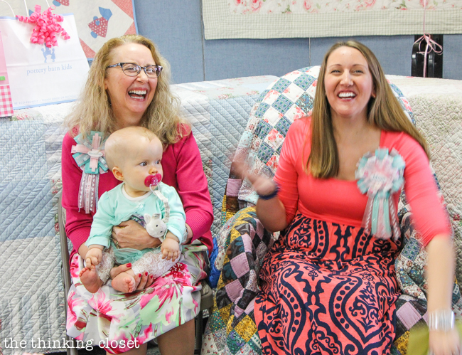"Cute as a Button" Baby Shower | DIY & Handmade Baby Shower Ideas to Inspire a Party to Remember! Vintage quilts add warmth and coziness to the gift tables and rocking chair!