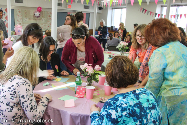"Cute as a Button" Baby Shower | DIY & Handmade Baby Shower Ideas to Inspire a Party to Remember! Here was our origami crane station where guests folded their own paper cranes that they hung on a mobile for the nursery!