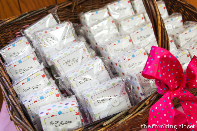 "Cute as a Button" Baby Shower | DIY & Handmade Baby Shower Ideas to Inspire a Party to Remember! Here was our button-themed favor station, complete with "Cute as a Button" soap, chocolate lollipops, and Bible verses to pray over baby.
