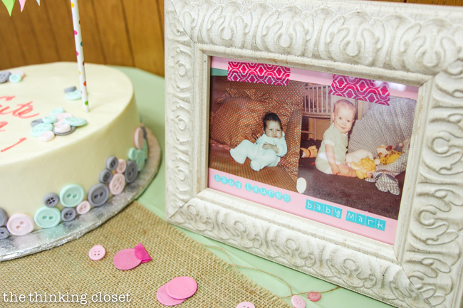 "Cute as a Button" Baby Shower | DIY & Handmade Baby Shower Ideas to Inspire a Party to Remember! The cake table, complete with button cake, baby photos of the parents-to-be, and countdown blocks!