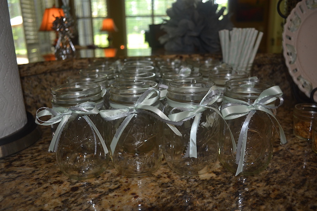 Charming Mint & Gray Baby Shower | Inspiration for planning a meaningful baby shower for a mom-to-be with creative ideas for decor, food, games, activities, a guest book, favors, and more! Here's a glimpse at the food and drink they served. Punch in mason jars was the perfect thirst quencher on a hot Florida spring day!