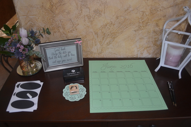 Charming Mint & Gray Baby Shower | Inspiration for planning a meaningful baby shower for a mom-to-be with creative ideas for decor, food, games, activities, a guest book, favors, and more! Here's a glimpse at the guest book...a prediction of when Baby Girl might be born!
