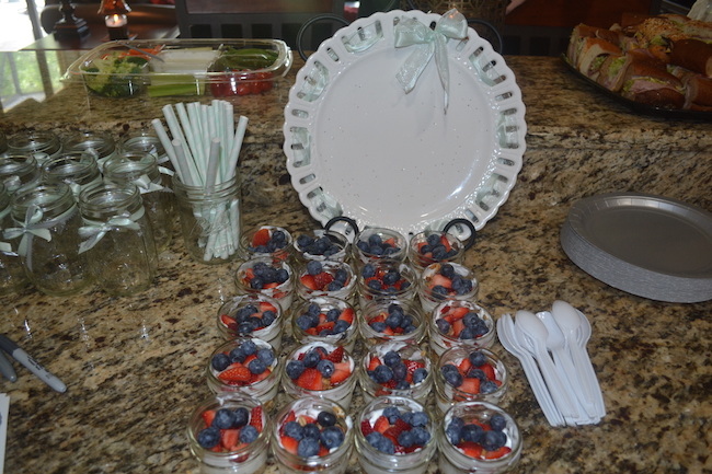 Charming Mint & Gray Baby Shower | Inspiration for planning a meaningful baby shower for a mom-to-be with creative ideas for decor, food, games, activities, a guest book, favors, and more! I devoured several of these yogurt parfaits. The mini mason jars added to their charm!