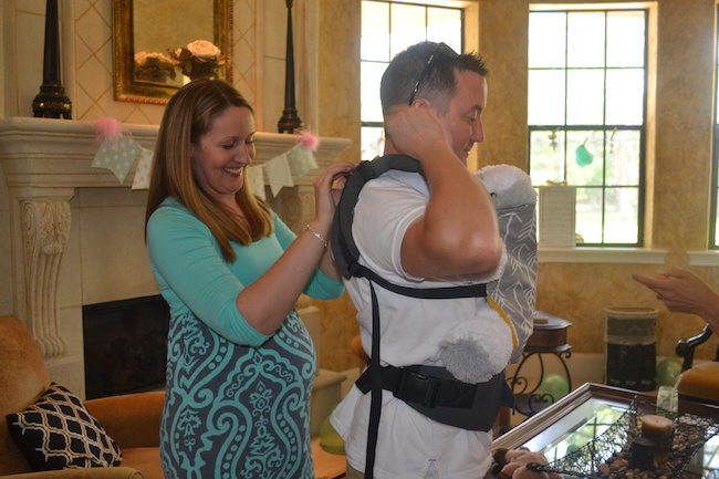 Hubby stole the show when he made a surprise entrance wearing a Tula Baby Carrier...but holding a stuffed dog inside for practice!