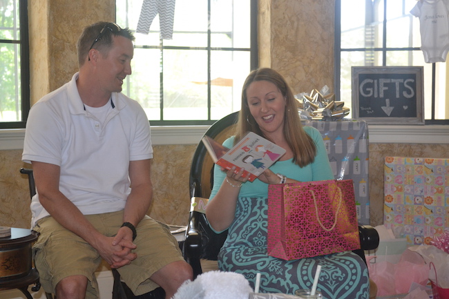 Charming Mint & Gray Baby Shower | Inspiration for planning a meaningful baby shower for a mom-to-be with creative ideas for decor, food, games, activities, a guest book, favors, and more! Here's a glimpse the mama and papa to be opening their gifts....