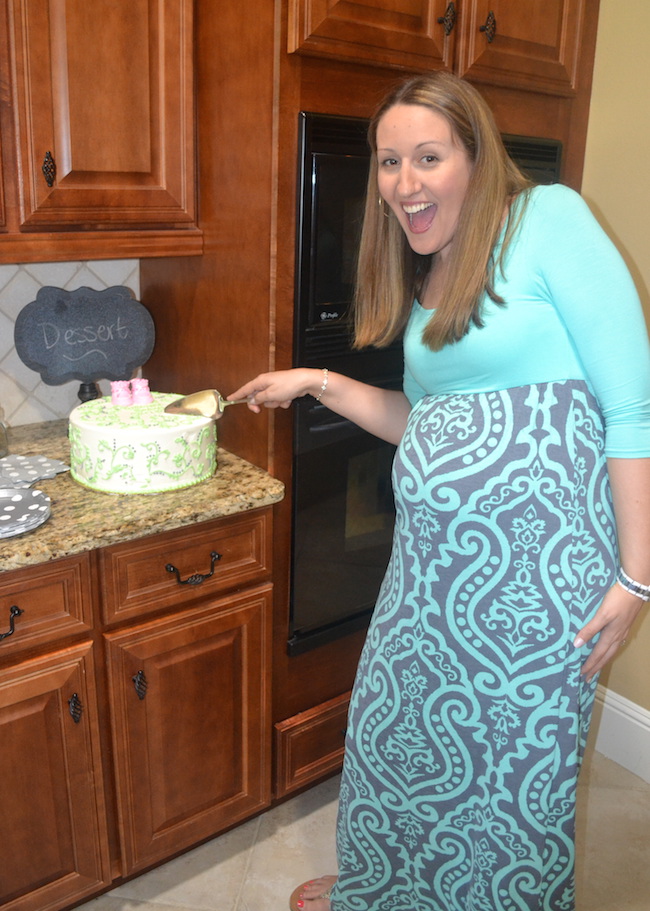 Charming Mint & Gray Baby Shower | Inspiration for planning a meaningful baby shower for a mom-to-be with creative ideas for decor, food, games, activities, a guest book, favors, and more! Here's a glimpse at the scrumptious cake that perfectly matched the mint and gray color scheme. The booties are a keepsake now in Baby Girl's nursery!