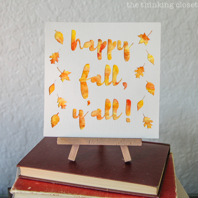 "Happy Fall, Y'all!" Watercolor Art: A Silhouette Cameo 3 Tutorial - After peeling up my adhesive backed cardstock, I applied it to my watercolor background for a vibrant, autumnal finished piece! Here are the black and white renditions for two unique, different looks.