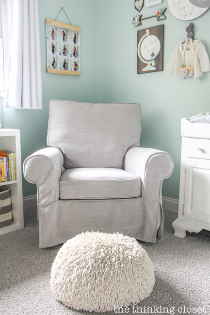 "Little Adventurer" Nursery Tour | An inspirational space with vintage-modern furniture, travel-themed decor, and a gender-neutral color palette of mint, gray, and white. This Comfort Swivel Rocker from Pottery Barn Kids in conjunction with the pouf from Land of Nod just make me want cuddle up for a nap! SO comfy.