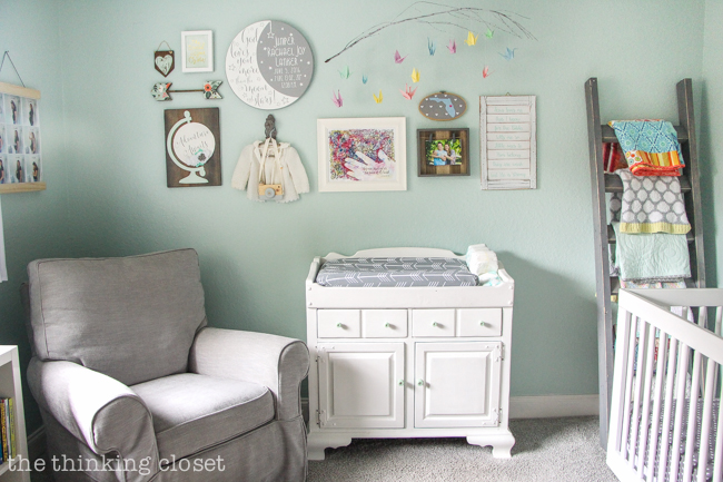 "Little Adventurer" Nursery Tour | An inspirational space with vintage-modern furniture, travel-themed decor, and a gender-neutral color palette of mint, gray, and white. This gallery wall is SO inspiring! I love the eclectic mix of DIY pieces, custom art, and vintage treasures.