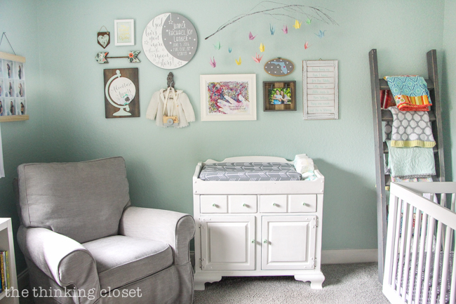 "Little Adventurer" Nursery Tour | An inspirational space with vintage-modern furniture, travel-themed decor, and a gender-neutral color palette of mint, gray, and white. This gallery wall is SO inspiring! I love the eclectic mix of DIY pieces, custom art, and vintage treasures.