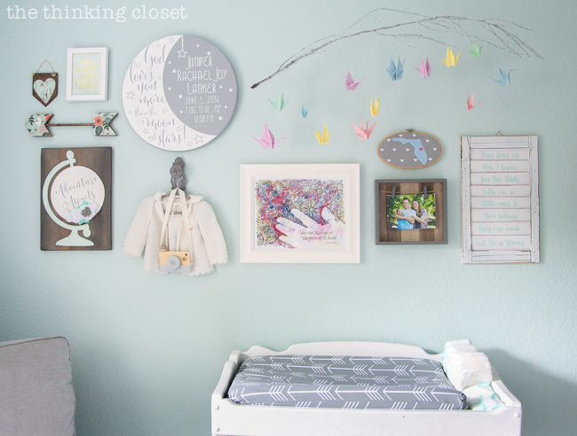 "Little Adventurer" Nursery Tour | An inspirational space with vintage-modern furniture, travel-themed decor, and a gender-neutral color palette of mint, gray, and white. This gallery wall is SO inspiring! I love the eclectic mix of DIY pieces, custom art, and vintage treasures.