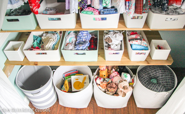 "Little Adventurer" Nursery Tour | An inspirational space with vintage-modern furniture, travel-themed decor, and a gender-neutral color palette of mint, gray, and white. This open shelving closet makes the type A organizer in me swoon! Just remove the closet doors, install a few shelves, and start filling it up with totes and baskets. Pretty AND functional. I can dig it!