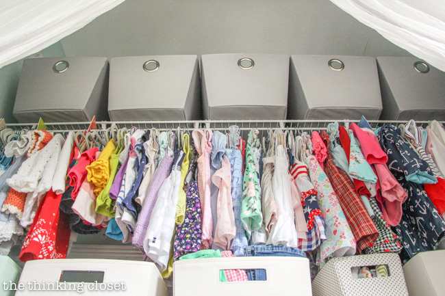 "Little Adventurer" Nursery Tour | An inspirational space with vintage-modern furniture, travel-themed decor, and a gender-neutral color palette of mint, gray, and white. This open shelving closet makes the type A organizer in me swoon! Just remove the closet doors, install a few shelves, and start filling it up with totes and baskets. Pretty AND functional. I can dig it!