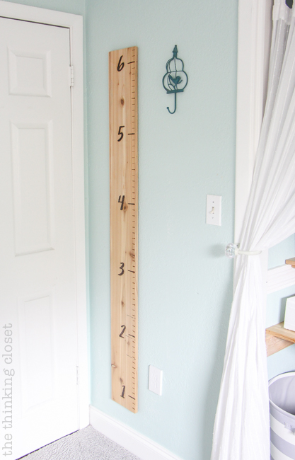 "Little Adventurer" Nursery Tour | An inspirational space with vintage-modern furniture, travel-themed decor, and a gender-neutral color palette of mint, gray, and white. The D.I.Y. large wall ruler is such a fun way to document the child's growth!