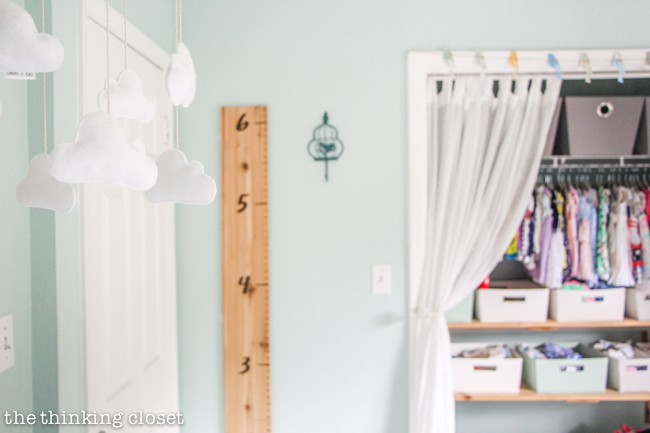"Little Adventurer" Nursery Tour | An inspirational space with vintage-modern furniture, travel-themed decor, and a gender-neutral color palette of mint, gray, and white. The D.I.Y. large wall ruler is such a fun way to document the child's growth!