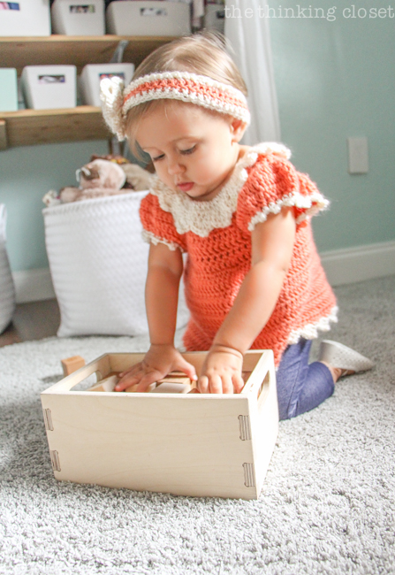 "Little Adventurer" Nursery Tour | An inspirational space with vintage-modern furniture, travel-themed decor, and a gender-neutral color palette of mint, gray, and white. Time to play with some alphabet blocks by Little Sapling Toys!