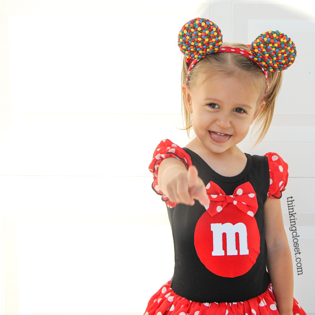 "Minnie M & M" Punny Halloween Costume Idea for a little girl, toddler, or baby...plus Disney-themed punny Halloween costumes for the parents! Check out the full post for the whole knee-slapping run-down!