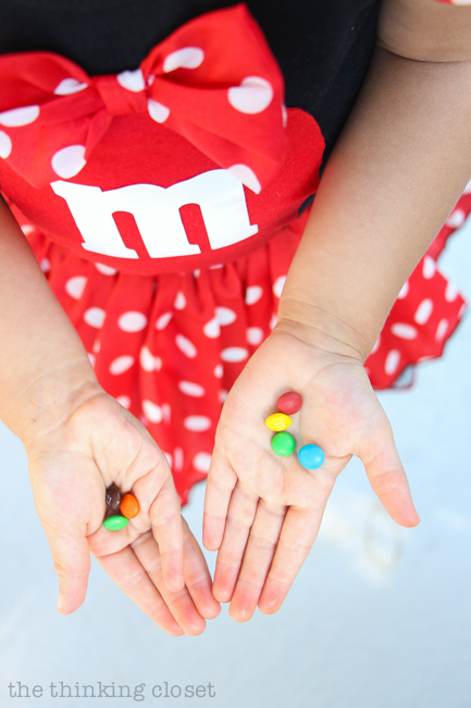 "Minnie M & M" Punny Halloween Costume Idea for a little girl, toddler, or baby...plus Disney-themed punny Halloween costumes for the parents! Check out the full post for the whole knee-slapping run-down!
