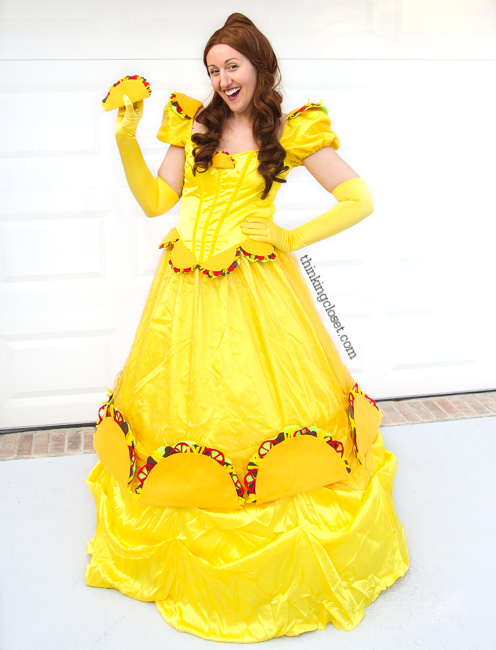 "Taco Belle" Punny Halloween Costume...just one of three clever Disney-themed Punny Halloween Costume ideas for the pun-loving family of three! Check out the post for the full DIY run-down on this creative costume and sneak a peek at Prince Charm-ing and Minnie M&M!