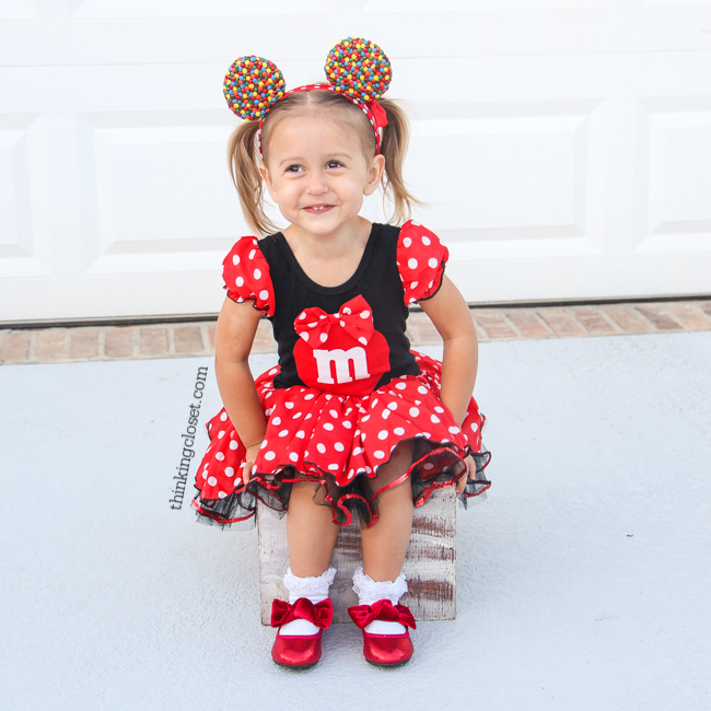 "Minnie M & M" Punny Halloween Costume Idea for a little girl, toddler, or baby...plus Disney-themed punny Halloween costumes for the parents! Check out the full post for the whole knee-slapping run-down!