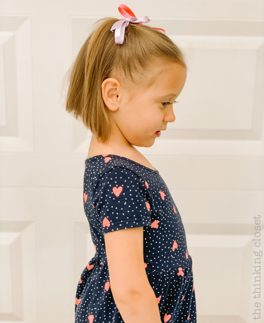 Juniper's new bob haircut...which helped her fit the part of Madeline at her party! | How to host a "Madeline In Paris"-themed 4th birthday party at home with creative DIY party activities, French decor, and costumes inspired by the classic Madeline children's books via ThinkingCloset.com