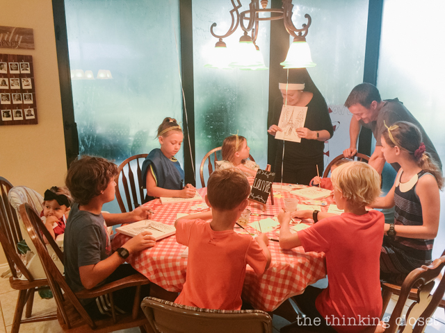 Each party guest got to paint their own art canvas at The Louvre. Each canvas featured a classic scene from Madeline (pre-selected by the kids), and they each got to take home their masterpiece as a party favor! | How to host a "Madeline In Paris"-themed 4th birthday party at home with creative DIY party activities, French decor, and costumes inspired by the classic Madeline children's books via ThinkingCloset.com