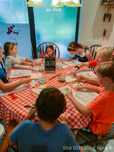 Each party guest got to paint their own art canvas at The Louvre. Each canvas featured a classic scene from Madeline (pre-selected by the kids), and they each got to take home their masterpiece as a party favor! | How to host a "Madeline In Paris"-themed 4th birthday party at home with creative DIY party activities, French decor, and costumes inspired by the classic Madeline children's books via ThinkingCloset.com