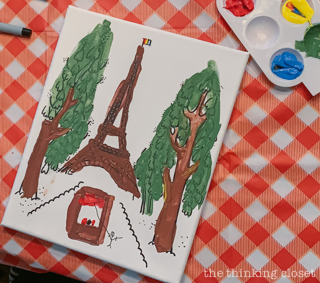 Each party guest got to paint their own art canvas at The Louvre. Each canvas featured a classic scene from Madeline (pre-selected by the kids), and they each got to take home their masterpiece as a party favor! | How to host a "Madeline In Paris"-themed 4th birthday party at home with creative DIY party activities, French decor, and costumes inspired by the classic Madeline children's books via ThinkingCloset.com