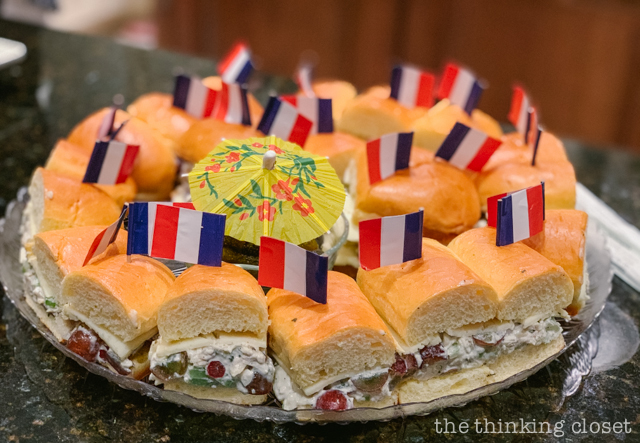 We offered a light Parisian-style lunch of sandwiches decorated with French flag toothpicks! | How to host a "Madeline In Paris"-themed 4th birthday party at home with creative DIY party activities, French decor, and costumes inspired by the classic Madeline children's books via ThinkingCloset.com