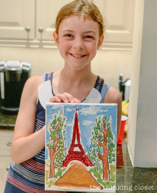 Each party guest got to paint their own art canvas at The Louvre. Each canvas featured a classic scene from Madeline (pre-selected by the kids), and they each got to take home their masterpiece as a party favor! | How to host a "Madeline In Paris"-themed 4th birthday party at home with creative DIY party activities, French decor, and costumes inspired by the classic Madeline children's books via ThinkingCloset.com