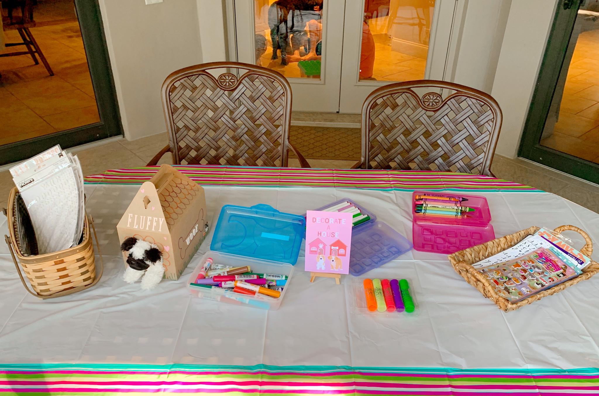 Pepper's 2nd Birthday "Puppy Paw-ty!" Creative party ideas via thinkingcloset.com - How to host a puppy-themed pawty with an adopt a puppy activity fun for all ages! The fourth station was where they decorated their dog house carriers!