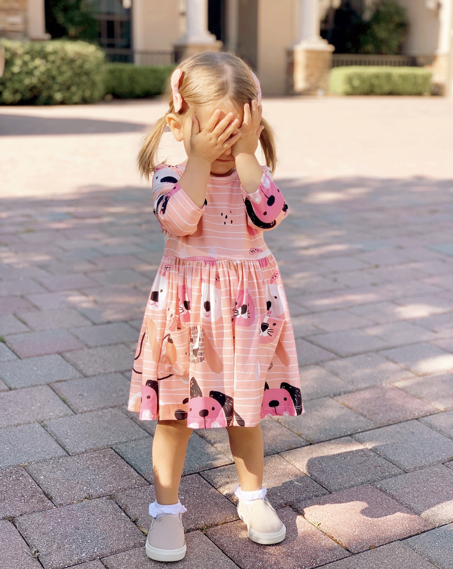 Pepper's 2nd Birthday "Puppy Paw-ty!" Creative party ideas via thinkingcloset.com - Doggy days pocket twirl dress with walking dog balloon for the cutest driveway photo shoot pre-party!