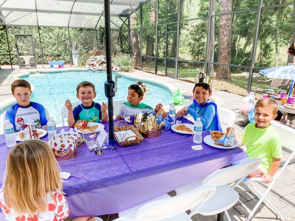 Juniper's "Princesses & Knights" 5th Birthday Pool Party & Royal Golden Birthday Celebration | Creative ideas including a punny invitation, DIY castle backdrop, a golden birthday banner, creative activities for kids of all ages & party favors galore! via thinkingcloset.com